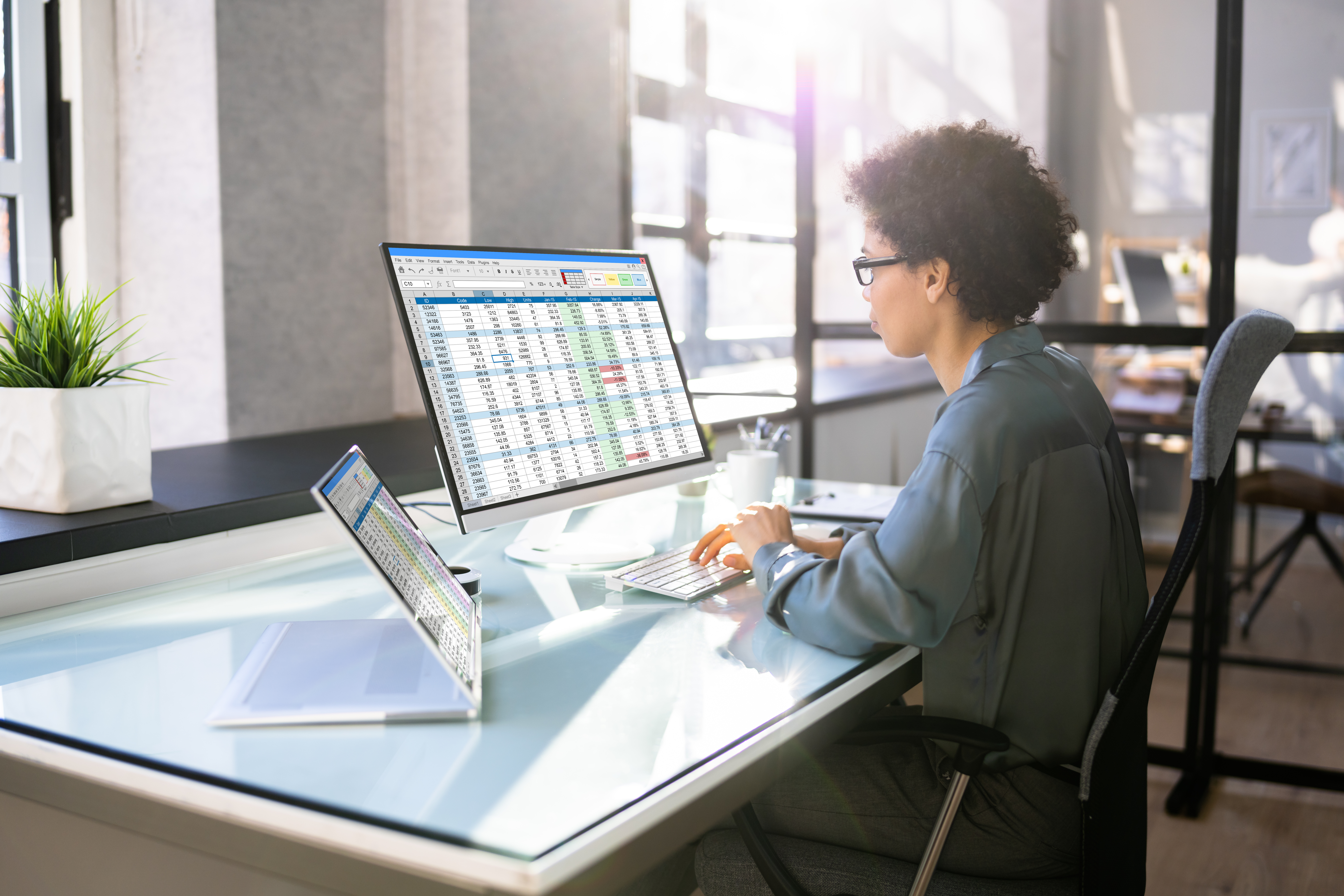 African American Office Employee Auditor Using Spreadsheet